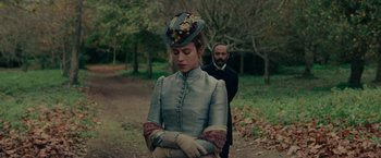 Movie still from “The Mad Women's Ball” (2021), directed by Mélanie Laurent – A man and a woman dressed in period clothing; Medium shot, Over the shoulder angle