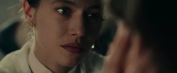 Movie still from “The Mad Women's Ball” (2021), directed by Mélanie Laurent – A woman's face in a mirror; Extreme Close Up shot, Over the shoulder angle