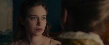 Movie still from “The Mad Women's Ball” (2021), directed by Mélanie Laurent – A young woman with blue eyes looking at a man; Close Up shot, Over the shoulder angle