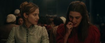 Movie still from “The Mad Women's Ball” (2021), directed by Mélanie Laurent – Two women sitting next to each other in a room; Close Up shot, Over the shoulder angle