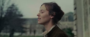 Movie still from “The Mad Women's Ball” (2021), directed by Mélanie Laurent – A woman with her eyes closed with her mouth open; Close Up shot, Low angle