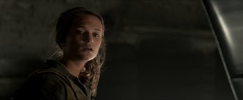 Movie still from “The Man from U.N.C.L.E.” (2015), directed by Guy Ritchie – A woman with a scarf around her neck; Close Up shot, Low angle