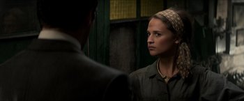 Movie still from “The Man from U.N.C.L.E.” (2015), directed by Guy Ritchie – A man and a woman looking at one another in a mirror; Close Up shot, Over the shoulder angle