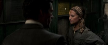 Movie still from “The Man from U.N.C.L.E.” (2015), directed by Guy Ritchie – A man and a woman looking at one another; Close Up shot, Over the shoulder angle