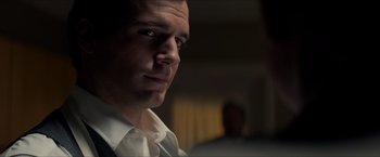Movie still from “The Man from U.N.C.L.E.” (2015), directed by Guy Ritchie – A person wearing a white shirt and tie; Close Up shot, Over the shoulder angle