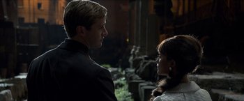Movie still from “The Man from U.N.C.L.E.” (2015), directed by Guy Ritchie – A man and a woman standing next to each other; Close Up shot, Over the shoulder angle