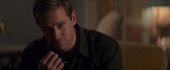 Movie still from “The Man from U.N.C.L.E.” (2015), directed by Guy Ritchie – A person wearing a black shirt; Close Up shot, Over the shoulder angle