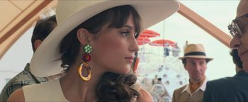 Movie still from “The Man from U.N.C.L.E.” (2015), directed by Guy Ritchie – A woman wearing a white hat and wearing a white hat; Close Up shot, Low angle