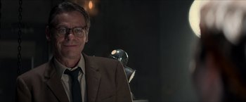 Movie still from “The Man from U.N.C.L.E.” (2015), directed by Guy Ritchie – A man in a suit and tie standing in front of a mirror; Close Up shot, Over the shoulder angle