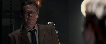 Movie still from “The Man from U.N.C.L.E.” (2015), directed by Guy Ritchie – A person wearing a suit and tie; Close Up shot, Over the shoulder angle