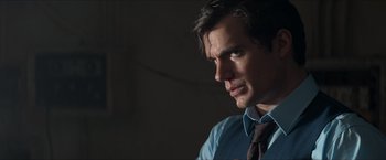 Movie still from “The Man from U.N.C.L.E.” (2015), directed by Guy Ritchie – A person wearing a shirt and a tie; Close Up shot, Over the shoulder angle