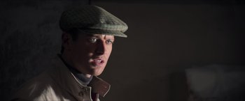Movie still from “The Man from U.N.C.L.E.” (2015), directed by Guy Ritchie – A man wearing a hat and a jacket; Close Up shot, Low angle