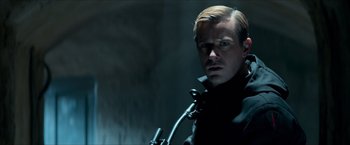 Movie still from “The Man from U.N.C.L.E.” (2015), directed by Guy Ritchie – A person wearing a black jacket; Close Up shot, Low angle