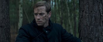 Movie still from “The Man from U.N.C.L.E.” (2015), directed by Guy Ritchie – A person wearing a black jacket; Close Up shot, Over the shoulder angle