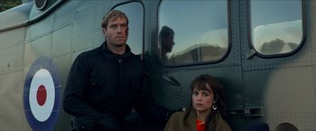 Movie still from “The Man from U.N.C.L.E.” (2015), directed by Guy Ritchie – A man and a woman sitting in a helicopter; Medium shot, Low angle