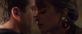 Movie still from “The Man from U.N.C.L.E.” (2015), directed by Guy Ritchie – A man and a woman face to face in the dark; Extreme Close Up shot, Over the shoulder angle