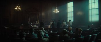 Movie still from “The Many Saints of Newark” (2021), directed by Alan Taylor – A group of people sitting in front of an audience; Extreme Wide shot, Low angle