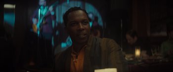 Movie still from “The Many Saints of Newark” (2021), directed by Alan Taylor – A man in a jacket is looking at the camera; Close Up shot, Over the shoulder angle