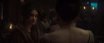 Movie still from “The Many Saints of Newark” (2021), directed by Alan Taylor – A woman in a fur coat and a woman in a fur coat; Close Up shot, Over the shoulder angle