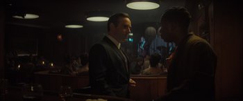 Movie still from “The Many Saints of Newark” (2021), directed by Alan Taylor – A man in a suit talking to another man; Medium shot, Over the shoulder angle