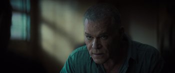 Movie still from “The Many Saints of Newark” (2021), directed by Alan Taylor – A person wearing a green shirt; Close Up shot, Over the shoulder angle
