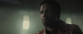 Movie still from “The Many Saints of Newark” (2021), directed by Alan Taylor – A person wearing a jacket; Close Up shot, Low angle