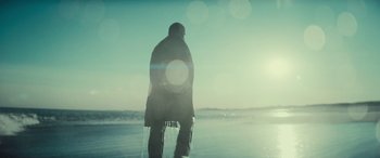 Movie still from “The Many Saints of Newark” (2021), directed by Alan Taylor – A man standing on the beach in the snow; Wide shot, Low angle