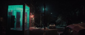 Movie still from “The Many Saints of Newark” (2021), directed by Alan Taylor – A car parked on the side of the road at night; Extreme Wide shot, Low angle