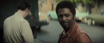 Movie still from “The Many Saints of Newark” (2021), directed by Alan Taylor – A person wearing a brown shirt; Close Up shot, Over the shoulder angle