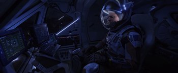 Movie still from “The Martian” (2015), directed by Ridley Scott – A man in a space suit sitting in a space ship; Wide shot, Overhead angle