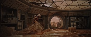 Movie still from “The Martian” (2015), directed by Ridley Scott – An image of a man in a space suit in a space station; Wide shot, Low angle
