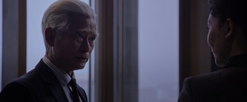 Movie still from “The Martian” (2015), directed by Ridley Scott – An older man with white hair looking out of a window; Close Up shot, Over the shoulder angle