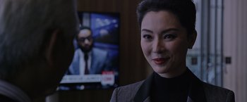 Movie still from “The Martian” (2015), directed by Ridley Scott – A woman standing in front of a television; Close Up shot, Over the shoulder angle