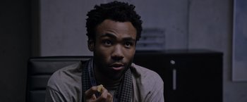 Movie still from “The Martian” (2015), directed by Ridley Scott – A person holding a piece of food; Close Up shot, Over the shoulder angle