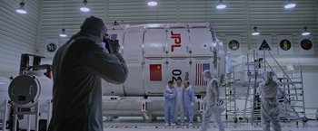 Movie still from “The Martian” (2015), directed by Ridley Scott – A group of people standing in front of a space ship; Wide shot, Over the shoulder angle