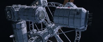 Movie still from “The Martian” (2015), directed by Ridley Scott – View of a clock on the side of a ferris wheel; Extreme Wide shot, Overhead angle