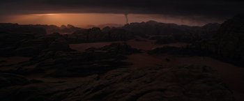 Movie still from “The Martian” (2015), directed by Ridley Scott – A view of a desert landscape with a tornado in the background; Extreme Wide shot, High angle