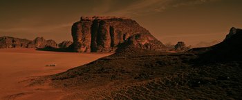 Movie still from “The Martian” (2015), directed by Ridley Scott – A large rock formation in the middle of the desert; Extreme Wide shot, High angle