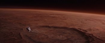 Movie still from “The Martian” (2015), directed by Ridley Scott – A view of a planet from space at night time; Extreme Wide shot, Overhead angle