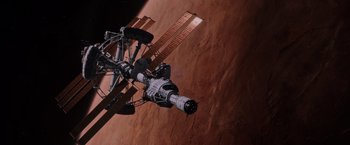 Movie still from “The Martian” (2015), directed by Ridley Scott – An image of a space station in the middle of the earth; Extreme Wide shot, Overhead angle