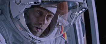 Movie still from “The Martian” (2015), directed by Ridley Scott – A person in a space suit; Close Up shot, Overhead angle