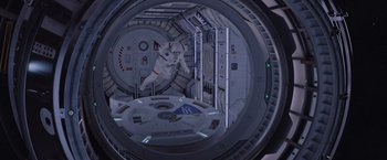 Movie still from “The Martian” (2015), directed by Ridley Scott – An image of an astronaut inside a space station; Wide shot, Overhead angle