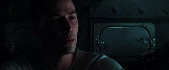 Movie still from “The Matrix” (1999), directed by Lana Wachowski – A person looking at the camera; Close Up shot, Low angle