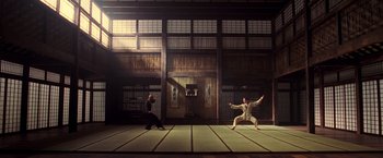 Movie still from “The Matrix” (1999), directed by Lana Wachowski – Two men are practicing martial arts in an oriental setting; Wide shot, Low angle