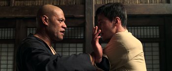 Movie still from “The Matrix” (1999), directed by Lana Wachowski – Two men are fighting each other in a room; Close Up shot, Over the shoulder angle