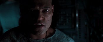 Movie still from “The Matrix” (1999), directed by Lana Wachowski – A person wearing a sweater; Close Up shot, Low angle