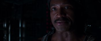 Movie still from “The Matrix” (1999), directed by Lana Wachowski – A person wearing a hat; Close Up shot, Low angle