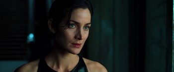 Movie still from “The Matrix” (1999), directed by Lana Wachowski – A person with blue eyes; Close Up shot, Over the shoulder angle