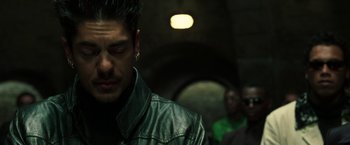Movie still from “The Matrix Reloaded” (2003), directed by Lana Wachowski – A person wearing a leather jacket; Close Up shot, Over the shoulder angle