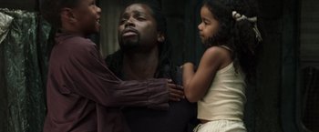 Movie still from “The Matrix Reloaded” (2003), directed by Lana Wachowski – A couple of people standing next to each other; Close Up shot, Low angle